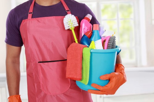 Carpet cleaning team preparing equipment safely in a residential property
